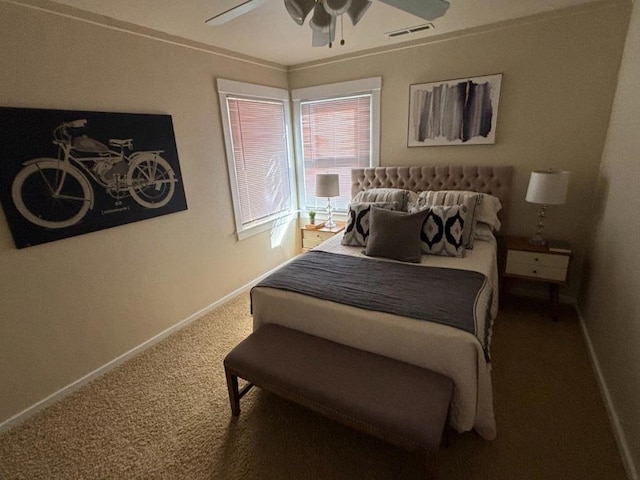 bedroom with ceiling fan, carpet, and crown molding