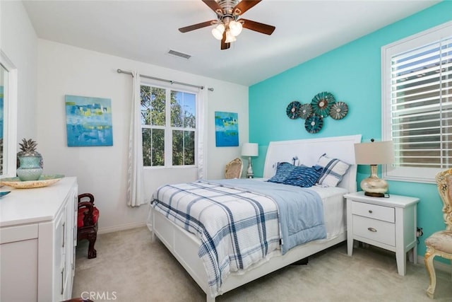 carpeted bedroom with ceiling fan