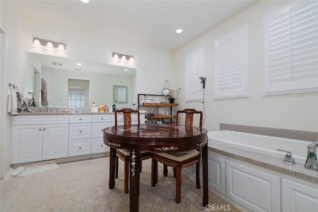 bathroom with a bathtub and vanity