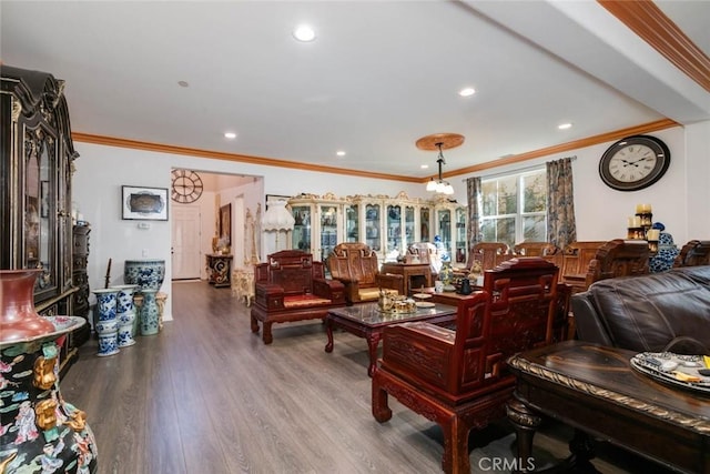 living room featuring wood-type flooring and ornamental molding