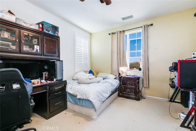 carpeted bedroom with ceiling fan