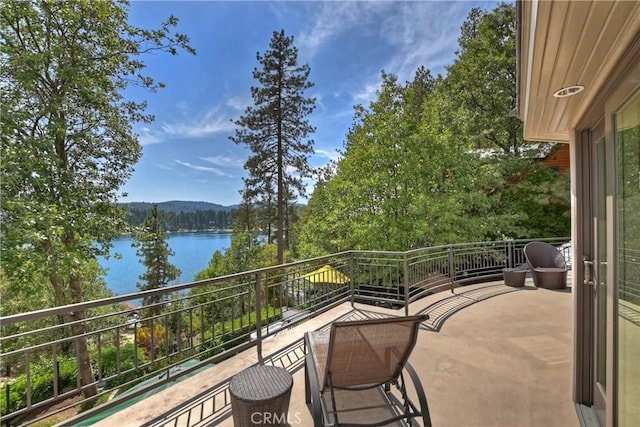 balcony featuring a water view