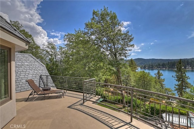 balcony featuring a water view