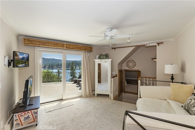 carpeted living room featuring ceiling fan and ornamental molding