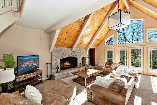 living room with light carpet, a stone fireplace, french doors, high vaulted ceiling, and beamed ceiling