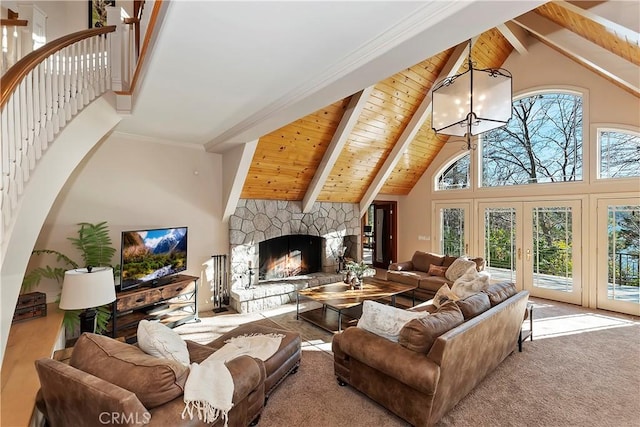 living room featuring wood ceiling, a fireplace, a chandelier, high vaulted ceiling, and beam ceiling