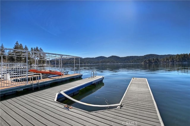 dock area featuring a water and mountain view