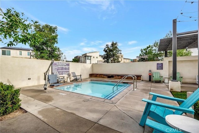 view of swimming pool featuring a patio area