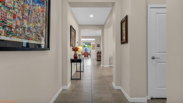 corridor featuring light tile patterned floors