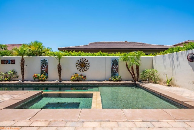 view of swimming pool featuring an in ground hot tub