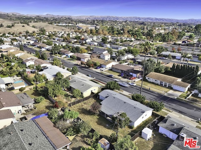 birds eye view of property with a mountain view