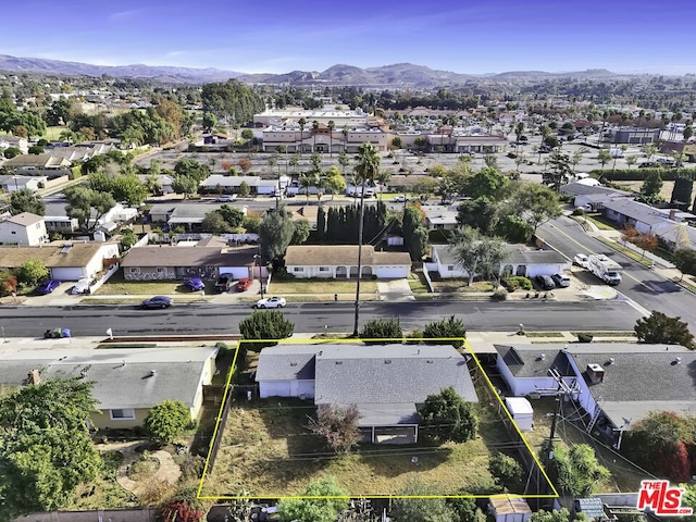 birds eye view of property with a mountain view