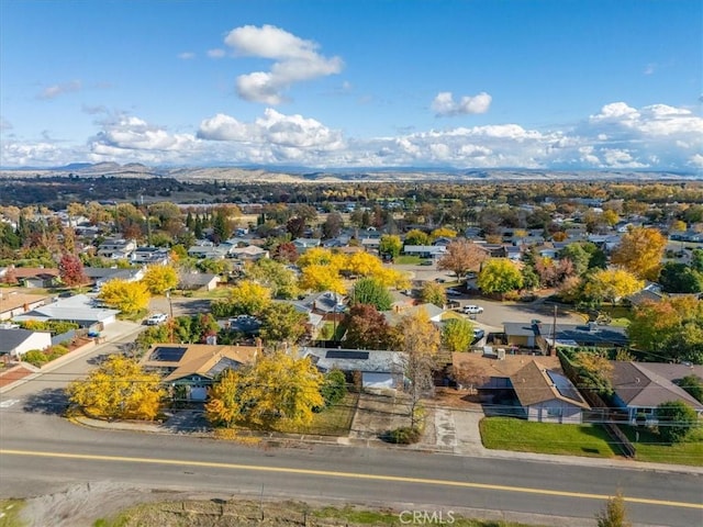 birds eye view of property featuring a mountain view