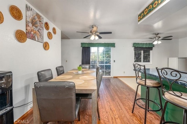 dining room featuring hardwood / wood-style flooring and ceiling fan