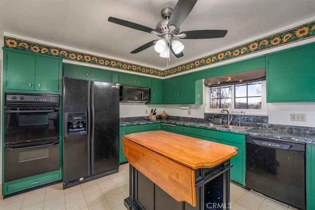 kitchen with ceiling fan, sink, black appliances, and green cabinetry