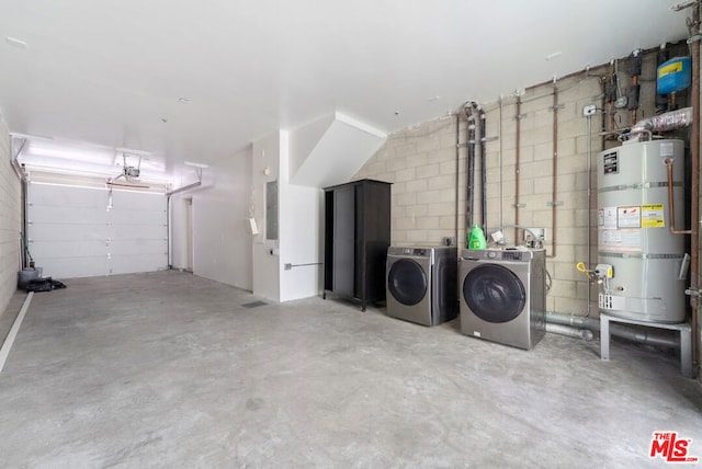 interior space with washing machine and dryer, electric panel, and water heater