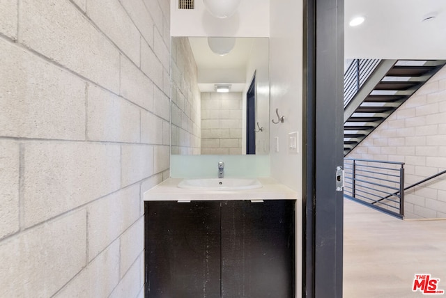 bathroom featuring hardwood / wood-style floors and vanity