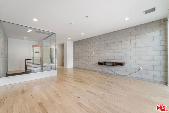 unfurnished living room featuring light hardwood / wood-style flooring