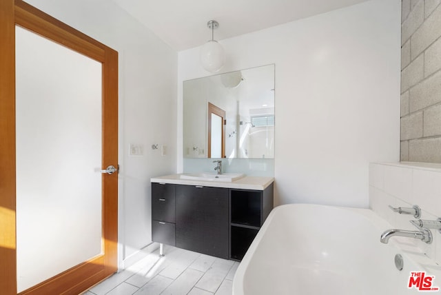 bathroom with a bathing tub and vanity