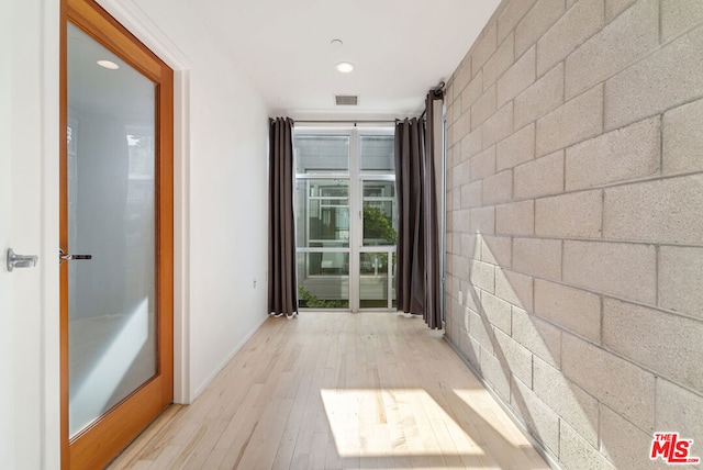 corridor featuring light wood-type flooring