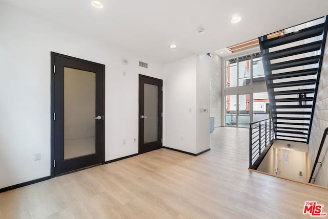 spare room featuring light hardwood / wood-style flooring