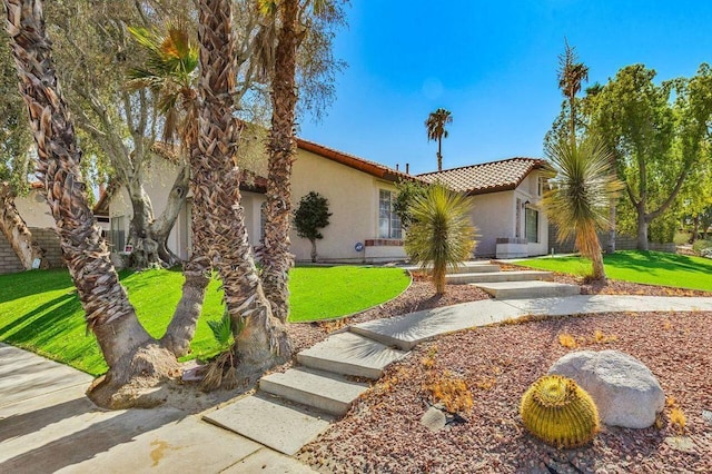 view of front of house with a front lawn