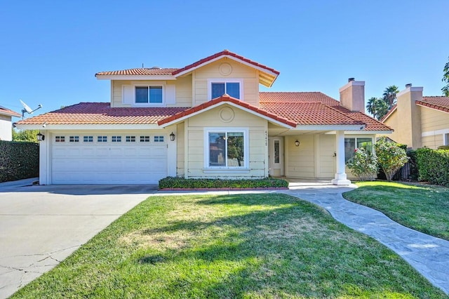 mediterranean / spanish-style home featuring a front yard and a garage