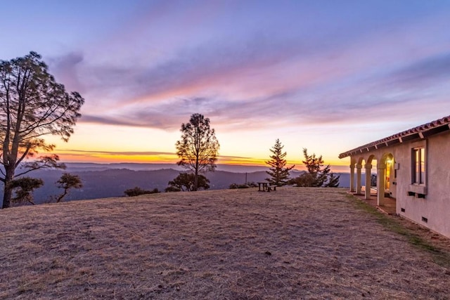 yard at dusk with a mountain view