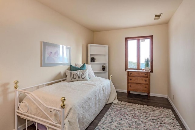 bedroom featuring dark wood-type flooring