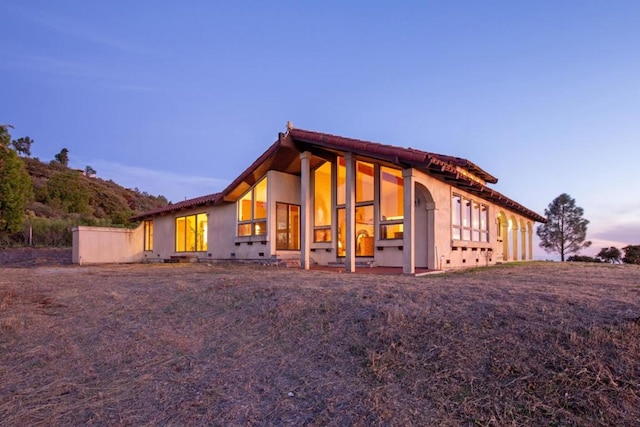 view of property exterior at dusk