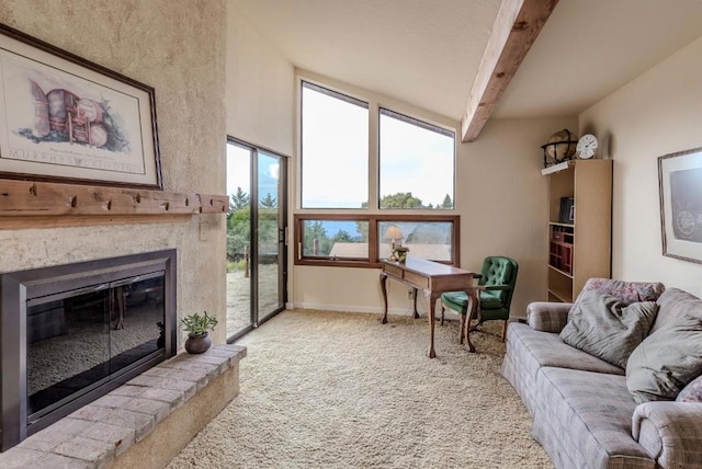 living room with carpet flooring and vaulted ceiling with beams