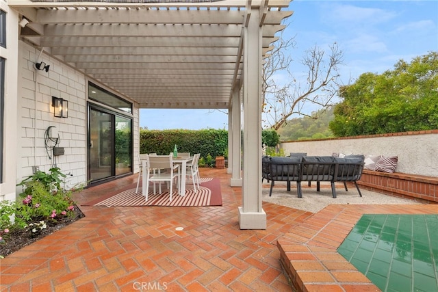 view of patio / terrace with outdoor lounge area and a pergola