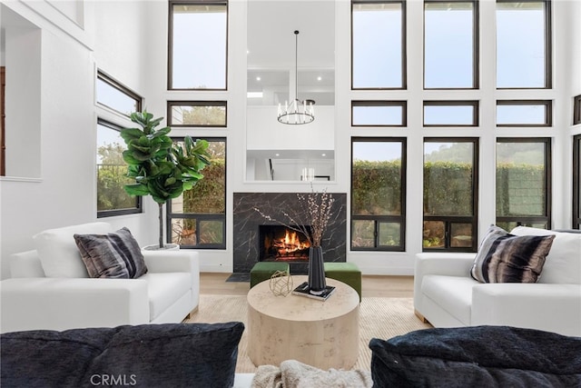 interior space featuring a fireplace and an inviting chandelier