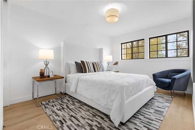 bedroom with wood-type flooring