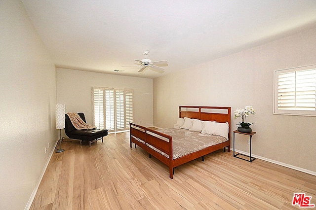 bedroom with ceiling fan and light wood-type flooring