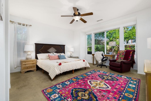 bedroom with ceiling fan and carpet floors