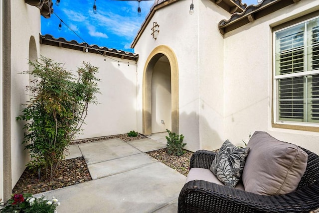 property entrance with a patio area