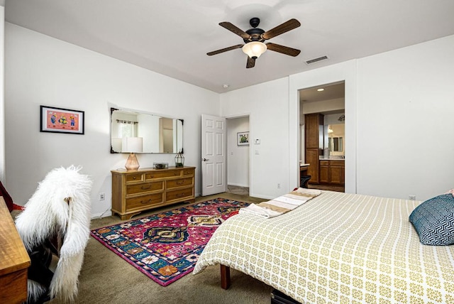 bedroom featuring ceiling fan, connected bathroom, and carpet floors