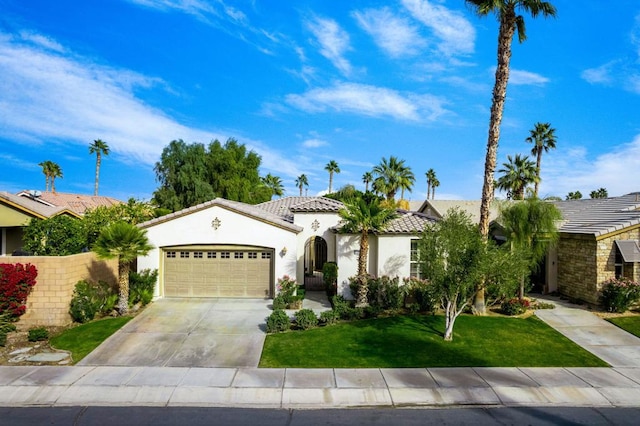 view of front of property featuring a front lawn and a garage