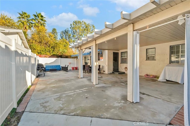 view of patio with an outdoor hangout area and a grill