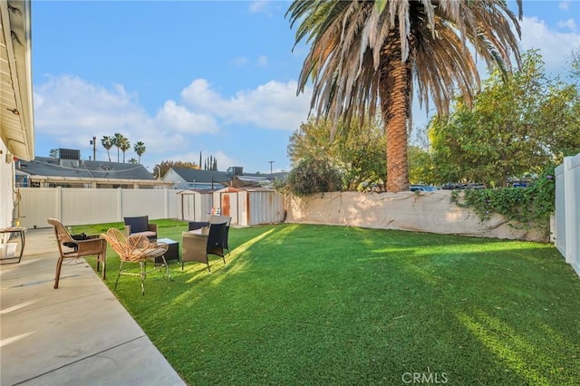 view of yard with a storage unit