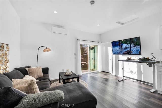 living room with a wall mounted AC and hardwood / wood-style flooring