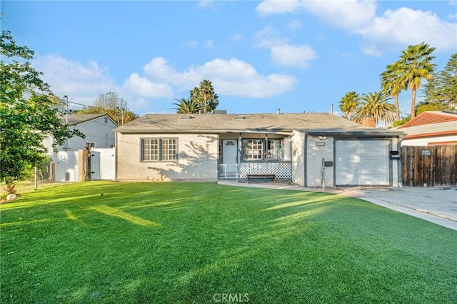 ranch-style home with a front lawn, a garage, and a porch