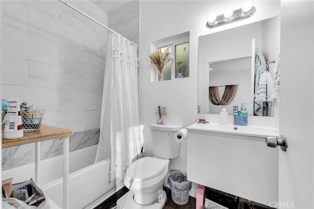 full bathroom with shower / bath combo with shower curtain, toilet, and vanity