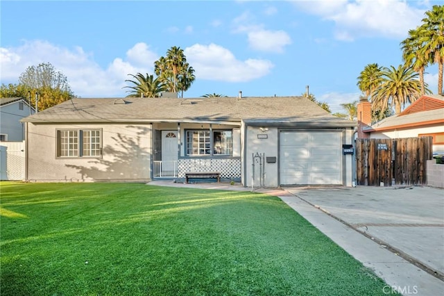 view of front facade with a garage and a front yard