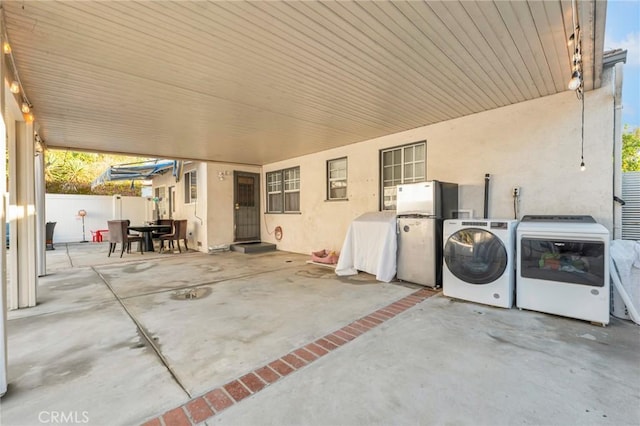 view of patio / terrace featuring washer and clothes dryer