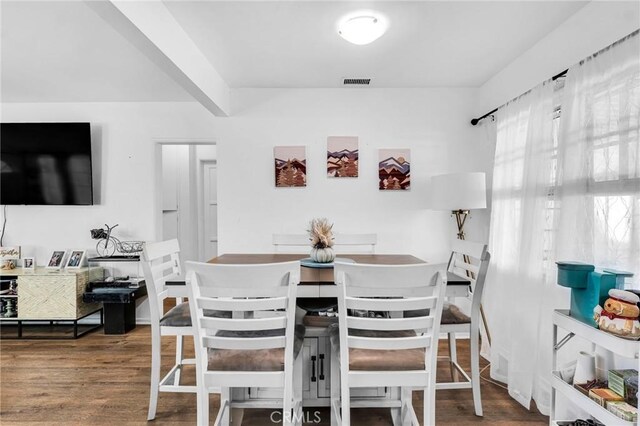 dining area featuring hardwood / wood-style floors