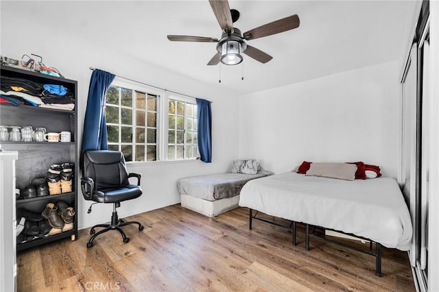 bedroom featuring ceiling fan and hardwood / wood-style floors