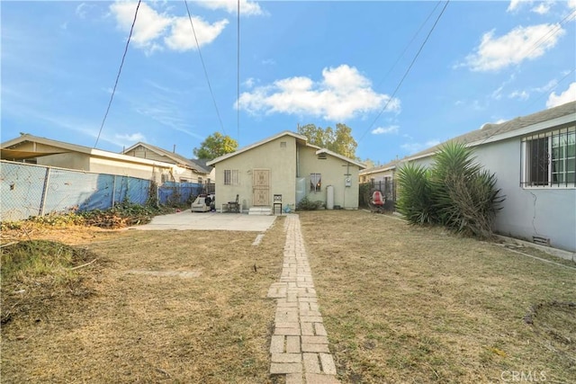 back of house with a patio area