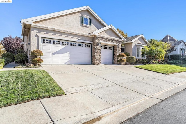 view of front of home featuring a garage, a front yard, and an AC wall unit